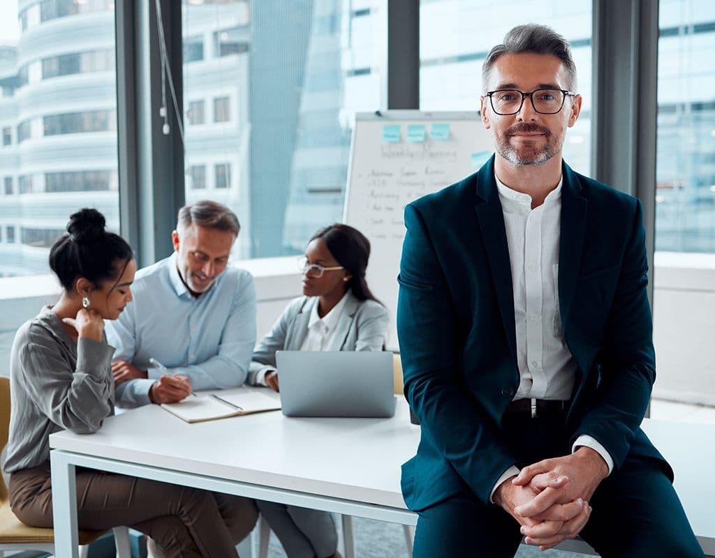Portrait, leadership and business man, ceo or entrepreneur in office meeting, company and team Corporate professional, executive and mature manager with confidence, pride and working with experience